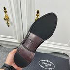 Prada unisex shoe outsole, black rubber sole with Prada branding.