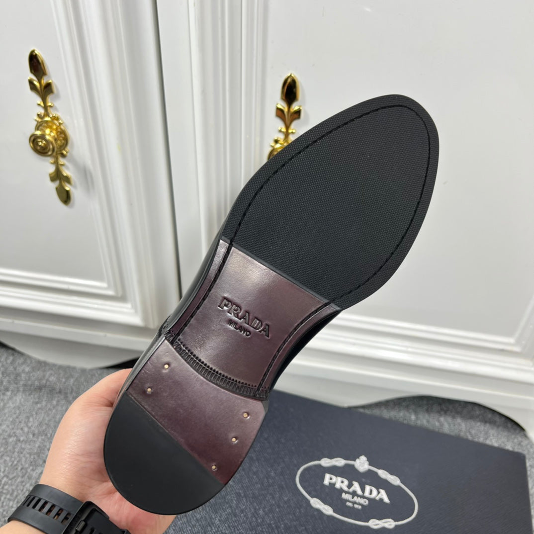 Prada unisex shoe outsole, black rubber sole with Prada branding.