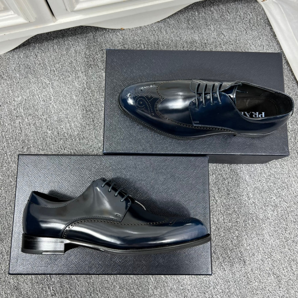 Prada unisex lace-up derby shoes, dark navy leather, side view with embossed logo