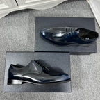 Prada unisex lace-up derby shoes, dark navy leather, side view with embossed logo