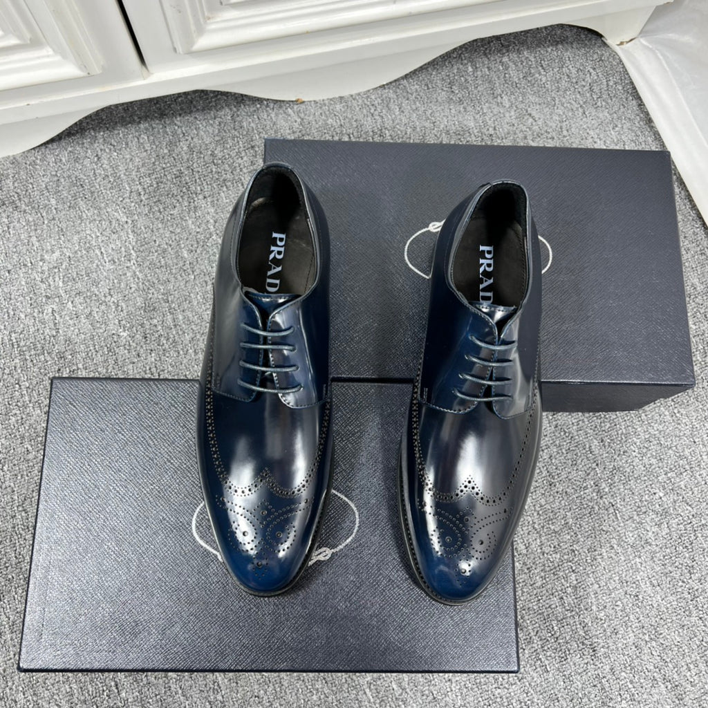 Prada unisex lace-up derby shoes, dark navy polished leather with brogue perforations
