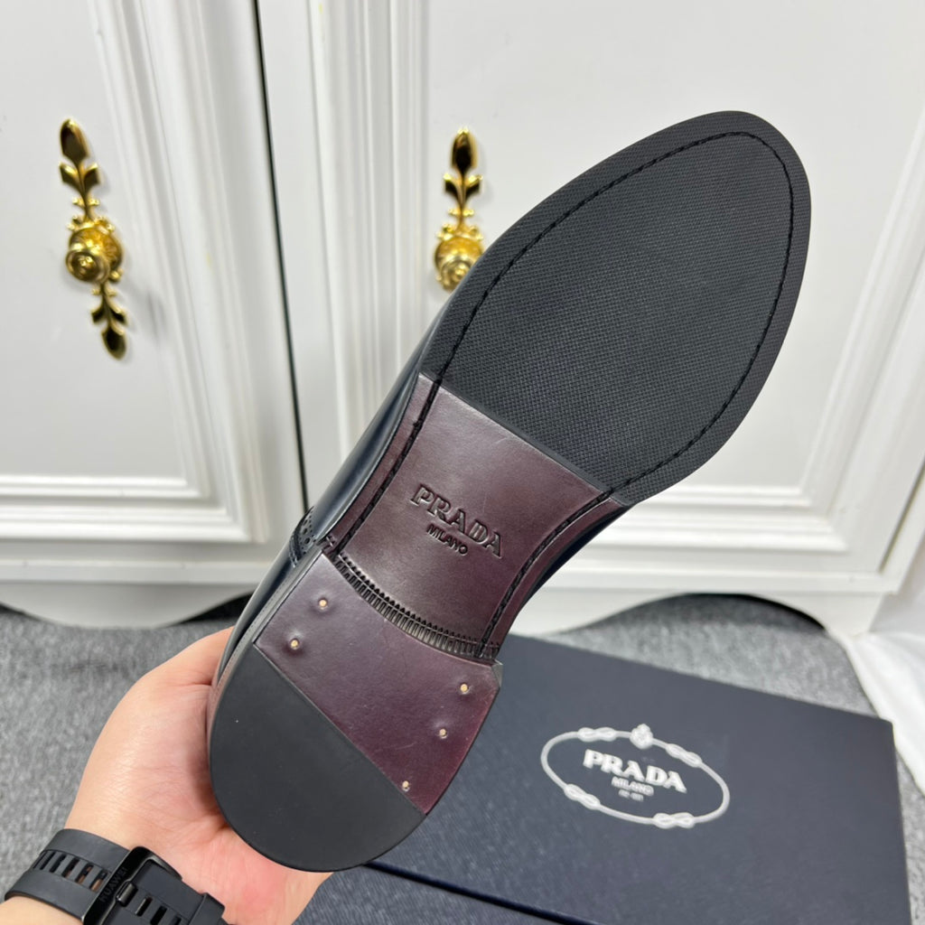 Prada unisex leather oxford shoe outsole, dark sole with Prada logo on heel
