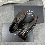Prada unisex leather lace-up dress shoes, front view with lace detail