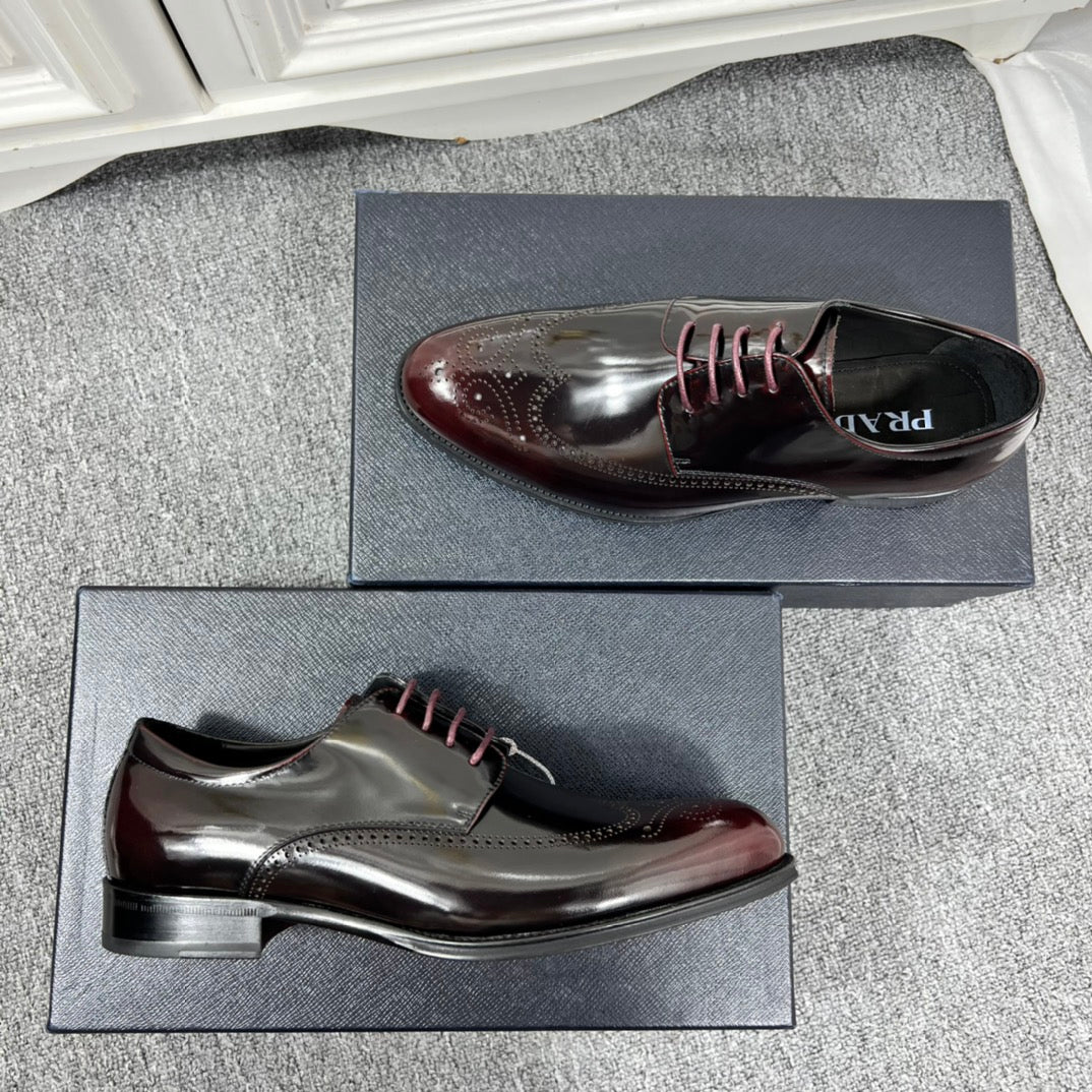 Prada unisex leather lace-up dress shoes, side and sole view on display