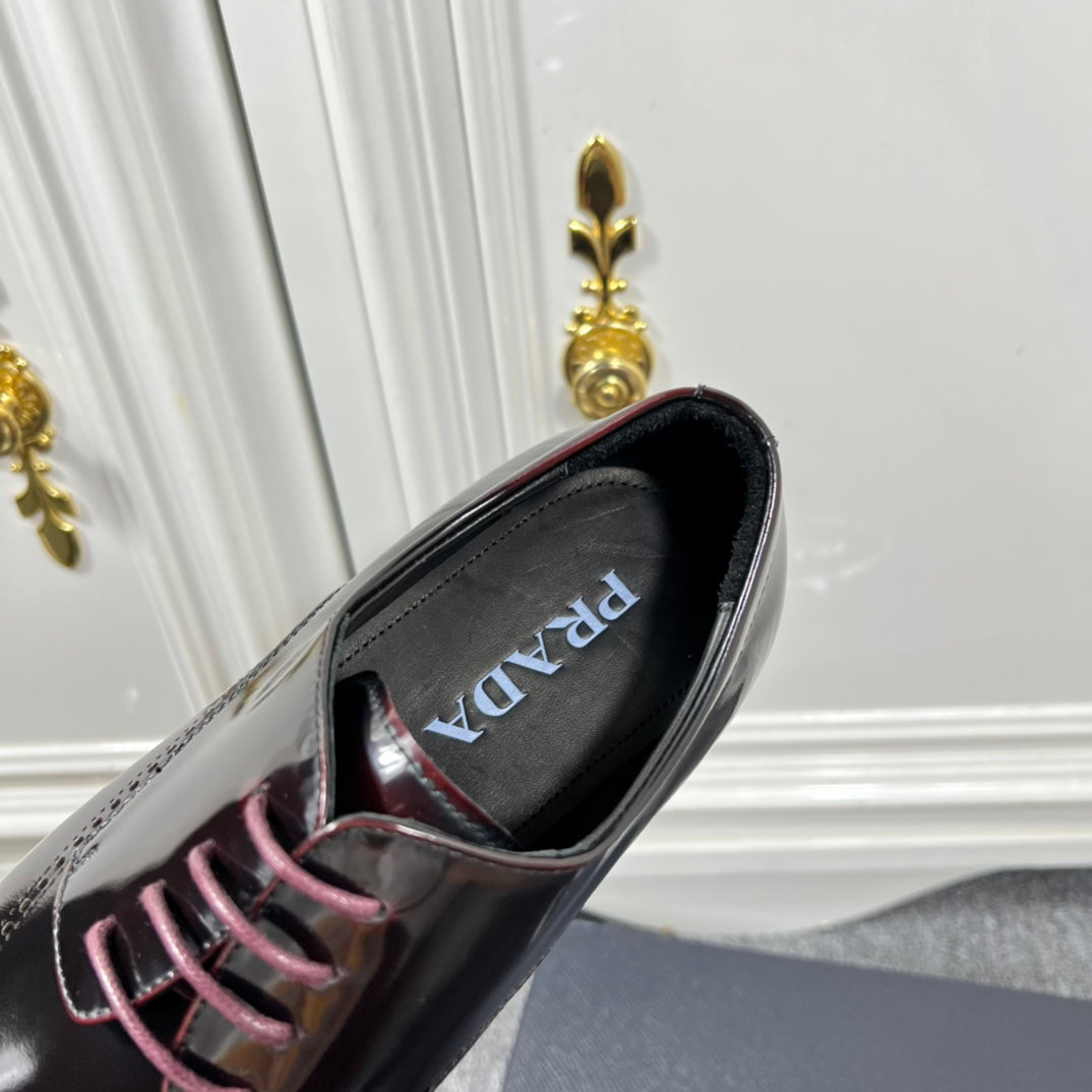 Prada unisex leather lace-up dress shoe, close-up of lace and logo tongue