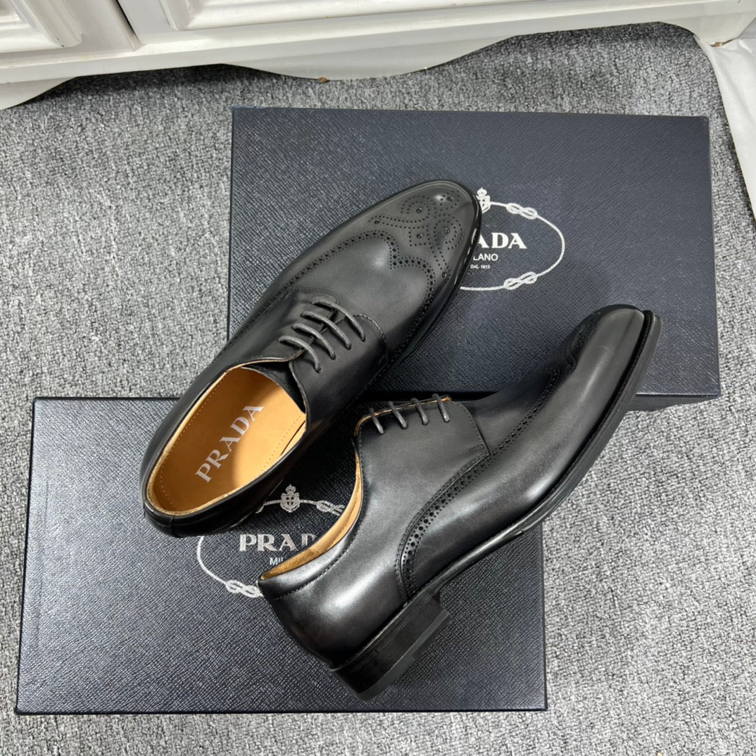 Prada unisex oxford shoes in black leather, angled view with lace-up brogue detailing.
