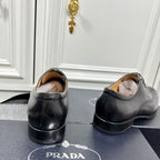Prada unisex leather lace-up shoes, rear view with low block heel