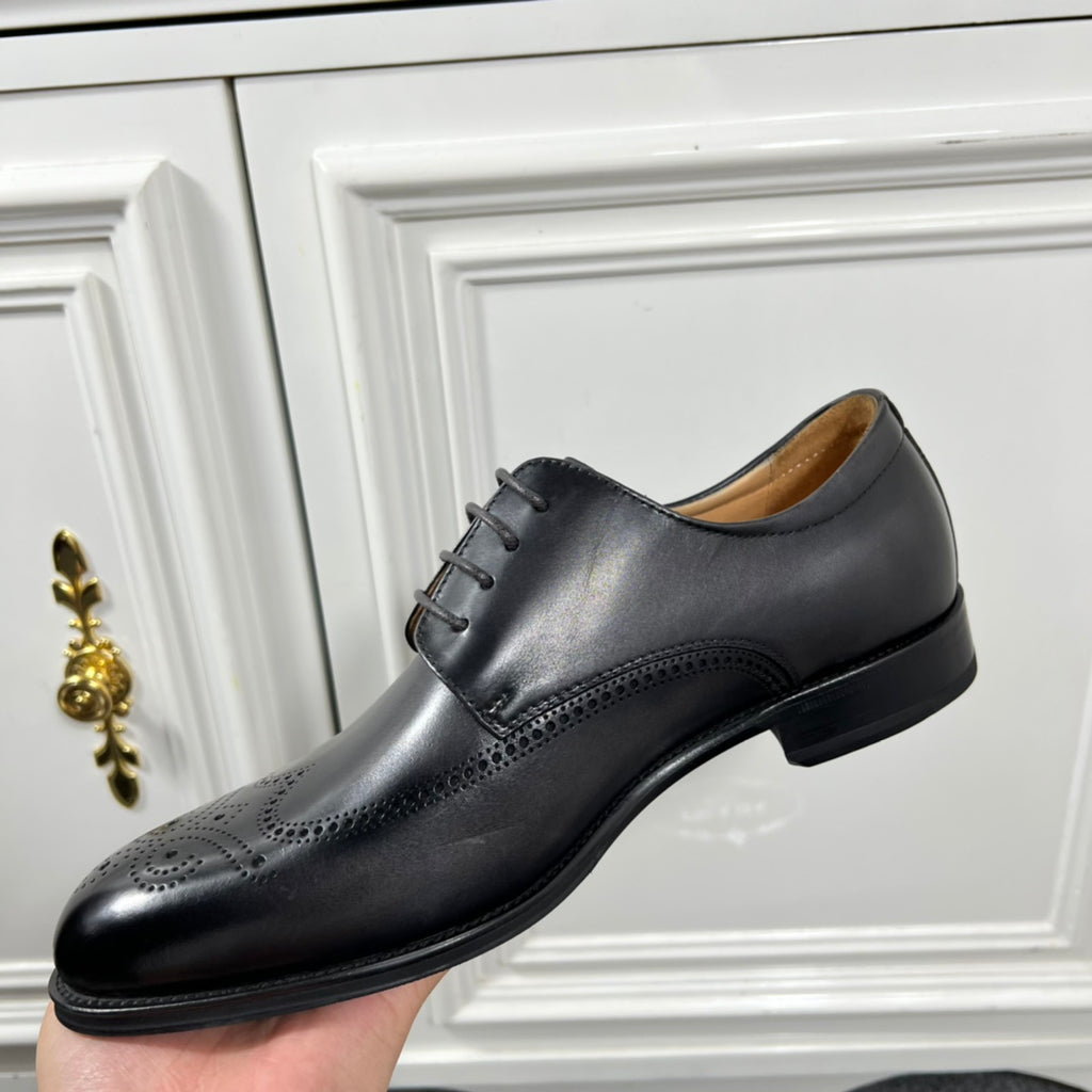 Prada unisex oxford shoes in black leather, front view with smooth cap toe.