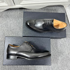 Prada unisex oxford shoes in black leather, front toe detail with lace-up.