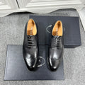 Prada unisex lace-up dress shoes, dark leather with brogue details