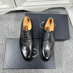 Prada unisex lace-up dress shoes, dark leather with brogue details