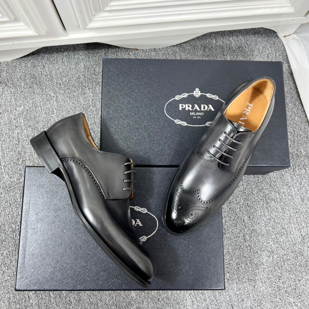 Prada unisex oxford shoes in black leather, side view with lace-up and brogue holes.