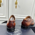 Prada unisex lace-up oxford shoes shown from heel, dark brown leather and black soles