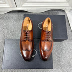 Prada unisex brown leather lace-up oxford shoes with brogue detailing and black sole
