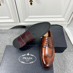 Prada unisex brown leather lace-up oxford shoe with view of outsole
