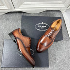 Prada unisex lace-up oxford shoes, dark brown leather with decorative brogue and black soles
