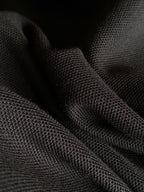 Black polo fabric texture close-up