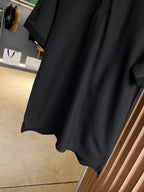 Black Burberry polo shirt hem and short sleeves