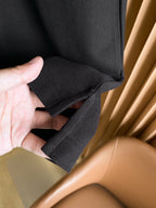 Burberry polo shirt sleeve cuff detail held in hand