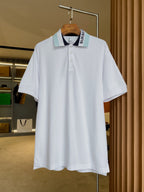 Burberry white short-sleeve polo shirt with button placket and logo collar