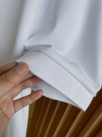 Burberry white polo shirt fabric fold and sleeve cuff detail