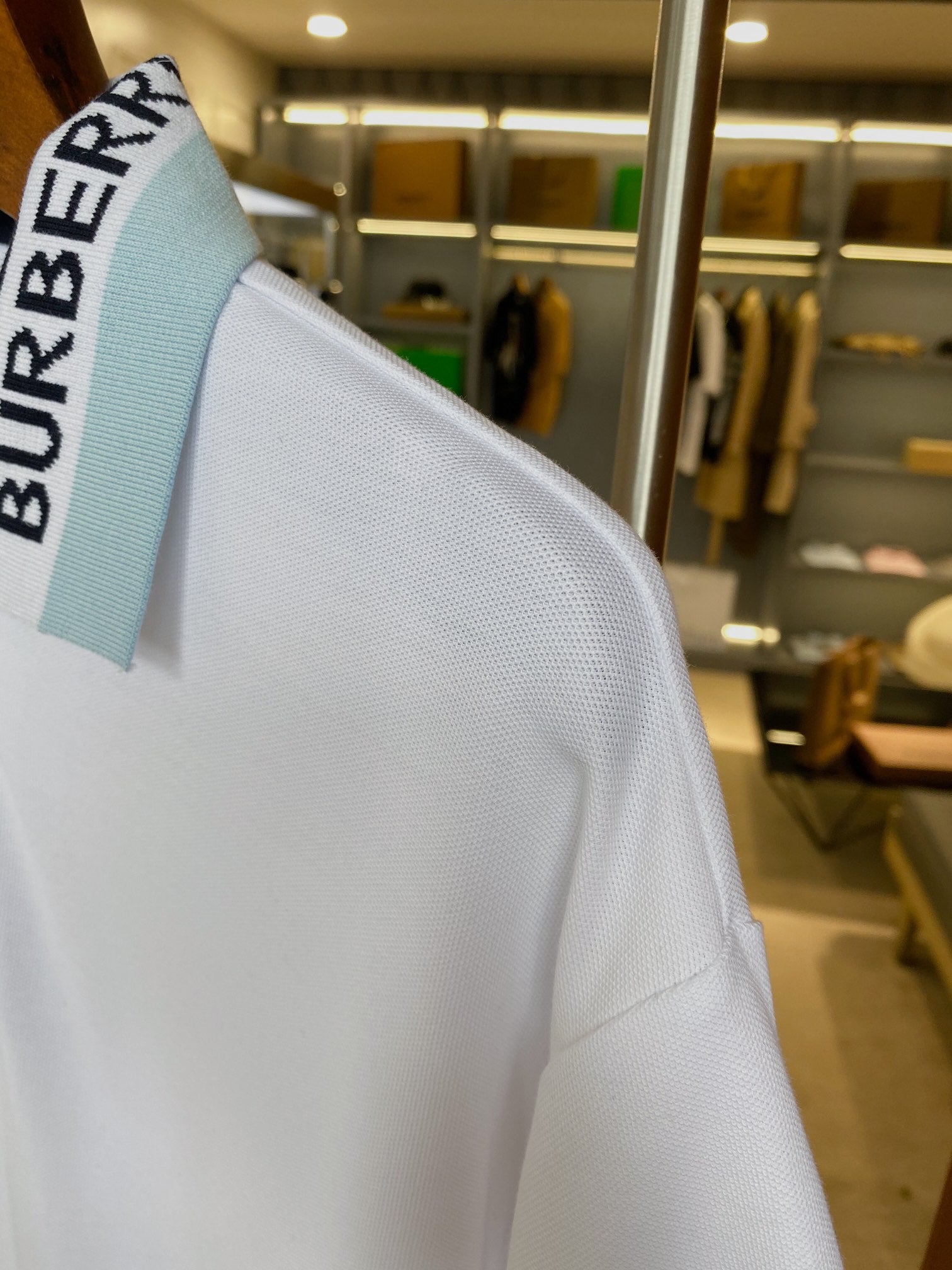 Burberry polo shirt collar detail with blue logo band