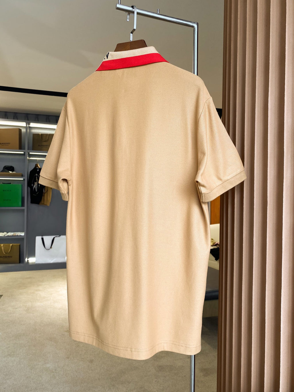Beige Burberry polo shirt back view with short sleeves and collar stripe