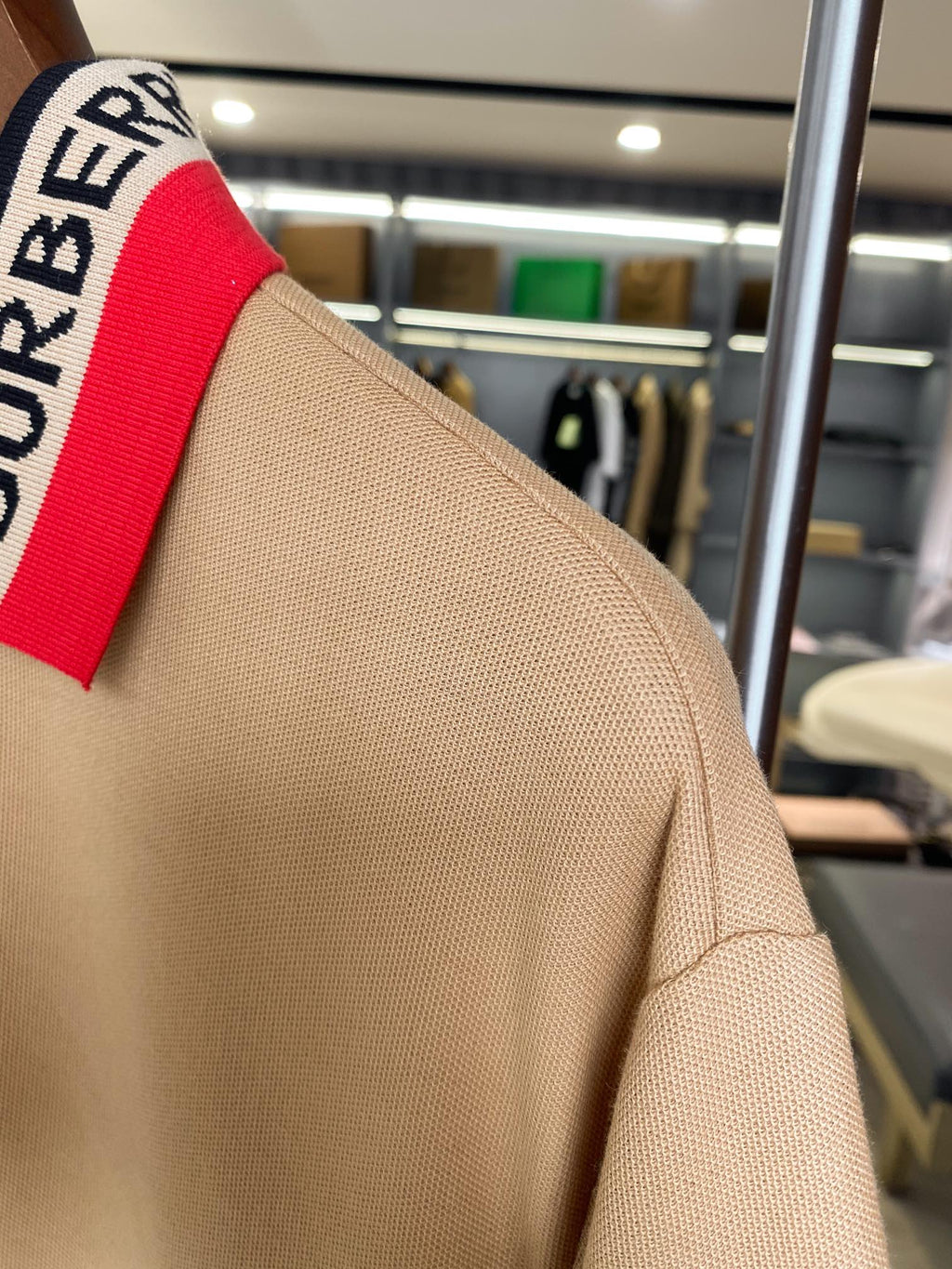 Beige Burberry polo shoulder and collar stripe detail, short sleeves
