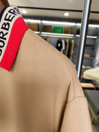 Beige Burberry polo shoulder and collar stripe detail, short sleeves