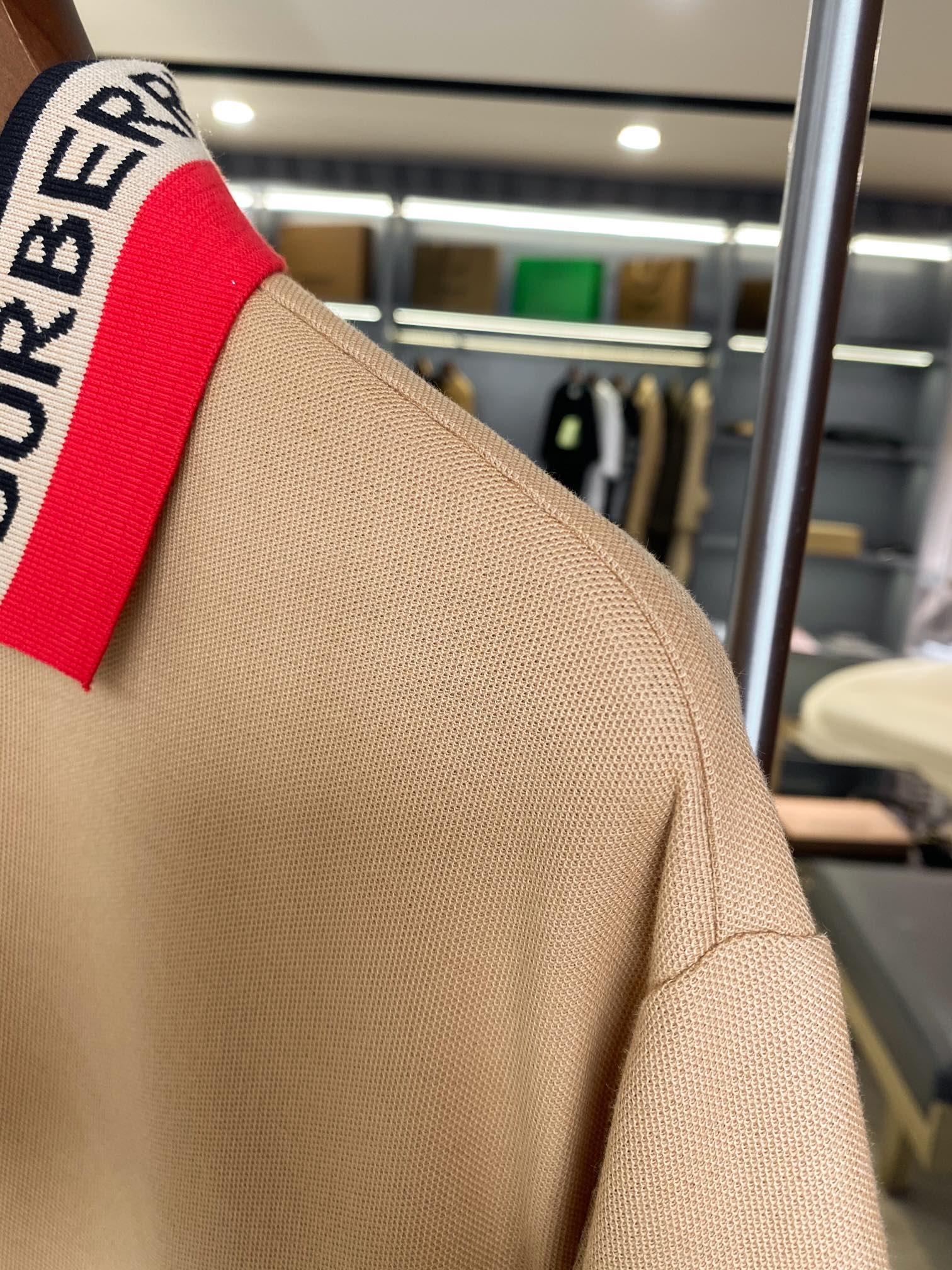 Beige Burberry polo shoulder and collar stripe detail, short sleeves