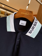 Navy Burberry polo shirt neckline with striped collar and button front