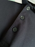 Navy textured polo shirt with three dark button placket