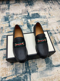 Black leather Gucci unisex loafers with horsebit detail and low sole, pair view