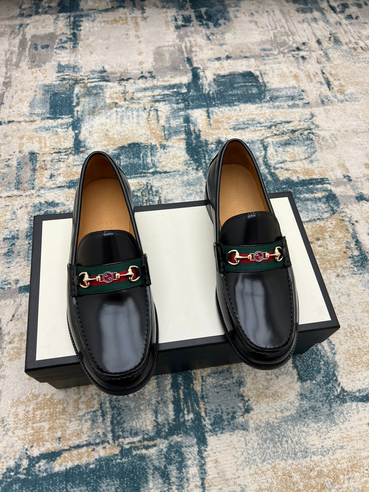 Black Gucci unisex loafer shoes with green and red horsebit detail on the vamp