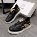 Men's Versace sneakers, black leather with gold baroque print and white rubber sole.