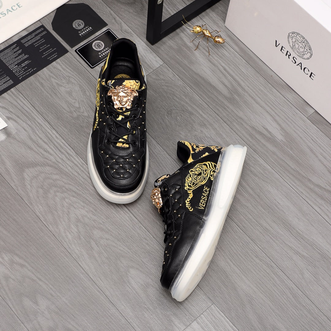 Men's Versace sneakers, black with gold ornament graphics, white sole, lace-up.