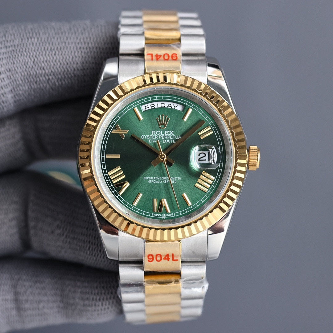 Two-tone Rolex watch with green dial, gold bezel, silver-and-gold bracelet.
