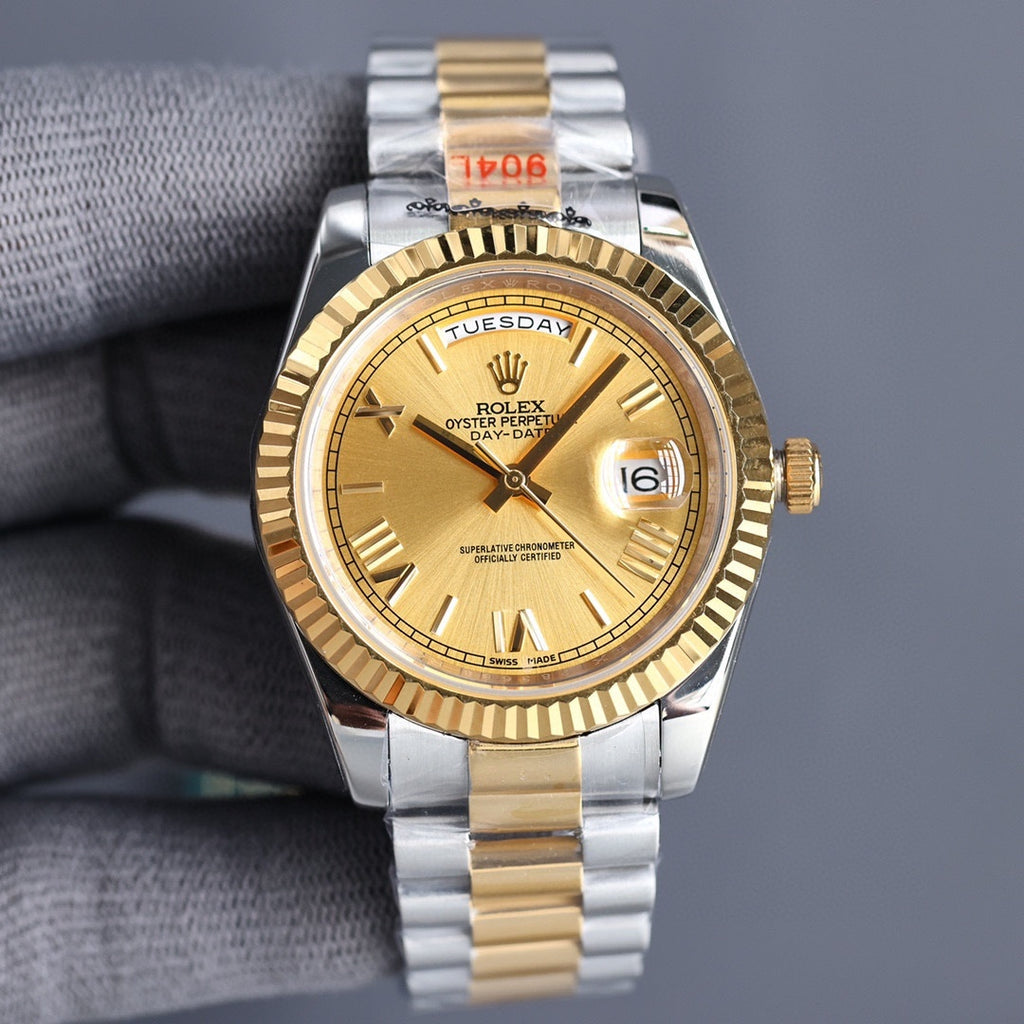 Two-tone Rolex watch with champagne dial, gold bezel, silver-and-gold bracelet.