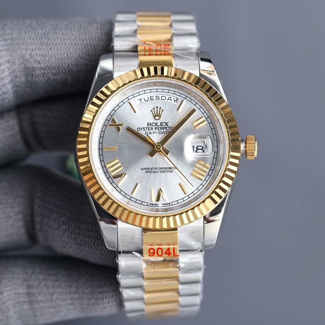 Two-tone Rolex watch with white dial and gold bezel, day/date display, steel bracelet