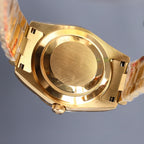 Gold-tone Rolex watch with gold bezel and bracelet, case side and crown visible