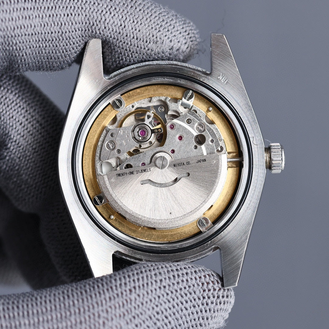 Rolex watch caseback view showing mechanical movement through open back