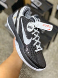 Black mesh low-top sneaker with white Swoosh and laced front, white midsole.