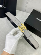 Light gray belt with gold-tone CC logo buckle detail