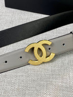 Light gray belt detail with gold-tone CC logo buckle and belt holes