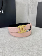 Pale pink leather belt with gold CC emblem centered on the wide strap.