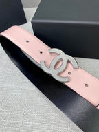 Pale pink leather belt with silver CC buckle emblem and dark backing edge.