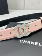 Pale pink leather belt with oversized silver CC buckle emblem on the front.