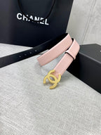 Pale pink leather belt with gold CC buckle on a wide adjustable strap.