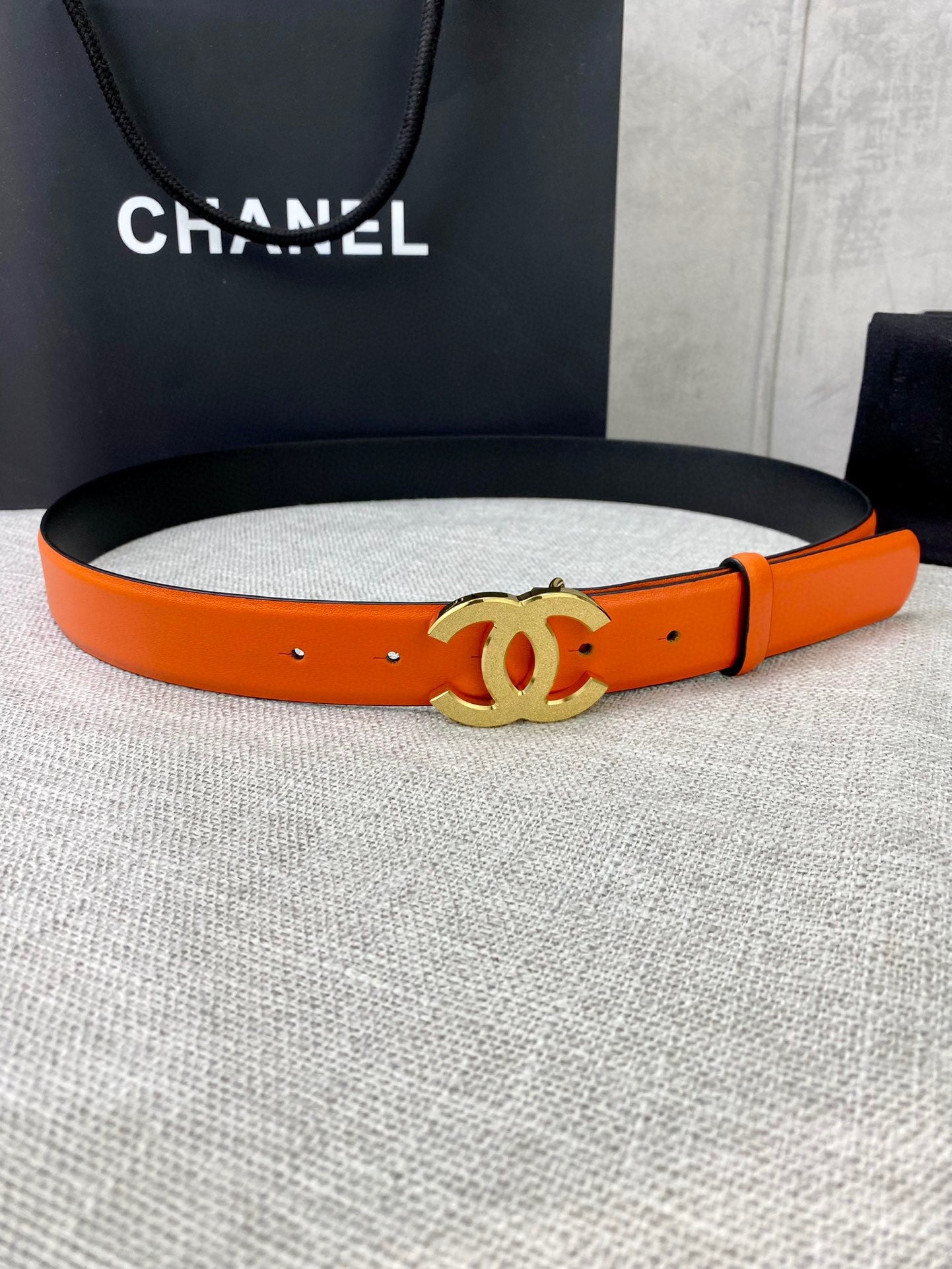 Chanel orange leather belt with gold CC buckle and adjustable holes