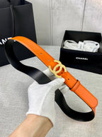 Chanel orange leather belt with gold CC buckle and black underside